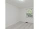 Carpeted bedroom featuring natural light from a window and fresh, white walls at 1537 Mutz Dr, Indianapolis, IN 46229