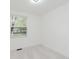 Bedroom with a window letting in natural light, and plush carpet at 1537 Mutz Dr, Indianapolis, IN 46229