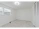 Bright, carpeted bedroom with natural light and a spacious closet at 1537 Mutz Dr, Indianapolis, IN 46229