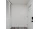 Bright entryway featuring a closet, front door with glass, and new vinyl flooring at 1537 Mutz Dr, Indianapolis, IN 46229