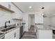 Updated kitchen with stone countertops, stainless steel appliances, and white shaker cabinets at 1537 Mutz Dr, Indianapolis, IN 46229