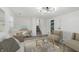 Cozy living space features a neutral color palette, desk, and a staircase leading to upper level at 1537 Mutz Dr, Indianapolis, IN 46229