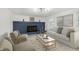Bright living room with fireplace, comfortable seating, and stylish decor at 1537 Mutz Dr, Indianapolis, IN 46229