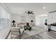 Bright living room featuring new floors, recessed lights, modern furnishings, and large windows at 1537 Mutz Dr, Indianapolis, IN 46229