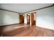 Bright bedroom featuring wood-look floors, trim, natural light and multiple entry doors at 180 Wellington Pkwy, Noblesville, IN 46060