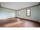 Spacious bedroom featuring wood-look floors, large windows for natural light and ample space at 180 Wellington Pkwy, Noblesville, IN 46060