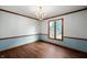 Elegant dining room featuring stylish chandelier, wood floors, and decorative molding at 180 Wellington Pkwy, Noblesville, IN 46060