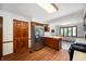 Traditional kitchen featuring stainless steel appliances, wooden cabinetry, and wood-look flooring at 180 Wellington Pkwy, Noblesville, IN 46060