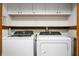 Updated laundry room with Whirlpool washer and dryer, and cabinets providing ample storage at 180 Wellington Pkwy, Noblesville, IN 46060