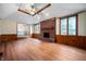 Bright living room with wood-look floors, fireplace, and ample natural light at 180 Wellington Pkwy, Noblesville, IN 46060