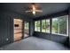 Inviting sunroom with access to kitchen, carpet flooring and windows with views of the backyard at 180 Wellington Pkwy, Noblesville, IN 46060
