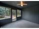 Cozy sunroom with beadboard walls and ceiling, carpet flooring and access to the deck at 180 Wellington Pkwy, Noblesville, IN 46060