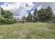 Large backyard with trees and lush lawn at 1924 W 65Th Pl, Indianapolis, IN 46260