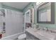 Inviting bathroom with a shower-tub, vanity, and plenty of storage space for toiletries at 1924 W 65Th Pl, Indianapolis, IN 46260