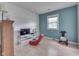 Bright bedroom featuring a window and modern furniture for relaxation and entertainment at 1924 W 65Th Pl, Indianapolis, IN 46260