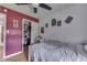 Bedroom features hardwood floors, red accent wall and closet at 1924 W 65Th Pl, Indianapolis, IN 46260