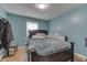 Cozy bedroom featuring a window, wood floors, and a warm, inviting ambiance at 1924 W 65Th Pl, Indianapolis, IN 46260
