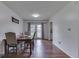 A view of the dining room featuring a wooden dining table and hardwood flooring at 1924 W 65Th Pl, Indianapolis, IN 46260