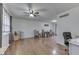 View of the living room with hardwood flooring and a dining space featuring a wooden table at 1924 W 65Th Pl, Indianapolis, IN 46260