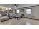 Living room featuring hardwood flooring, natural light, and cozy seating arrangement at 1924 W 65Th Pl, Indianapolis, IN 46260