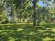 Wide backyard shot with well maintained grass and an outbuilding/shed on the property at 2024 E 41St St, Anderson, IN 46013