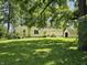 The backyard of the house features well-maintained grass and has an outbuilding/shed at 2024 E 41St St, Anderson, IN 46013
