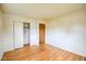 A bedroom featuring an open closet and hardwood floors at 2520 Tesh Dr, Indianapolis, IN 46203