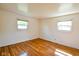A bright bedroom with hardwood floors and dual windows at 2520 Tesh Dr, Indianapolis, IN 46203