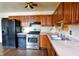 Kitchen featuring stainless steel appliances and wood cabinets at 2520 Tesh Dr, Indianapolis, IN 46203