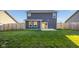 Large backyard with a privacy fence, manicured lawn and a patio at 341 Thistlewood Dr, Greenfield, IN 46140
