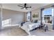 This bedroom features a comfy queen bed, ceiling fan, and views of the yard at 341 Thistlewood Dr, Greenfield, IN 46140