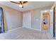 Neutral bedroom with ceiling fan, closet and open door to hallway at 341 Thistlewood Dr, Greenfield, IN 46140