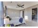 This cozy bedroom features a ceiling fan, walk in closet and plush carpeting at 341 Thistlewood Dr, Greenfield, IN 46140