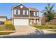 Charming two-story home with a well-maintained lawn and inviting curb appeal at 341 Thistlewood Dr, Greenfield, IN 46140