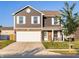 Charming two-story home with a well-maintained lawn and inviting curb appeal at 341 Thistlewood Dr, Greenfield, IN 46140
