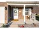 Inviting front porch with rocking chair, charming decor, and a welcoming entrance at 341 Thistlewood Dr, Greenfield, IN 46140