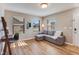 Inviting living room area with hardwood floors and a comfortable couch at 341 Thistlewood Dr, Greenfield, IN 46140