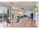 Open concept living and dining area with hardwood floors and sliding door to the backyard at 341 Thistlewood Dr, Greenfield, IN 46140