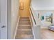 Carpeted staircase with white railing leading to upper level at 341 Thistlewood Dr, Greenfield, IN 46140