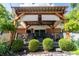 Inviting back deck featuring a pergola, outdoor seating, and lush landscaping at 37 E Waterbury Rd, Indianapolis, IN 46227