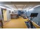 Basement area with a home bar, exercise equipment, and a doorway view at 37 E Waterbury Rd, Indianapolis, IN 46227