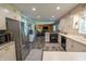 Open-concept kitchen leading into the living area, featuring modern appliances at 37 E Waterbury Rd, Indianapolis, IN 46227