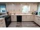 Well-lit kitchen with white cabinets and black appliances at 37 E Waterbury Rd, Indianapolis, IN 46227