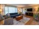 Inviting living room with a comfortable blue sofa and wood floors at 37 E Waterbury Rd, Indianapolis, IN 46227