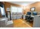 Bright home office featuring hardwood floors, large window, modern desk setup, and neutral walls at 37 E Waterbury Rd, Indianapolis, IN 46227