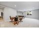 Finished basement with a pool table, poker table, and ample space for entertaining guests at 3711 Pete Dye Blvd, Carmel, IN 46033