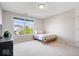 Cozy bedroom featuring a large window providing natural light and a neutral color scheme at 3711 Pete Dye Blvd, Carmel, IN 46033