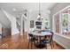 Dining room featuring hardwood floors, modern lighting and an open floor plan at 3711 Pete Dye Blvd, Carmel, IN 46033