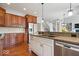 Gourmet kitchen with granite countertops, stainless steel appliances, and hardwood floors at 3711 Pete Dye Blvd, Carmel, IN 46033