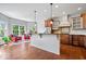 Gourmet kitchen with granite countertops, stainless steel appliances, and hardwood floors at 3711 Pete Dye Blvd, Carmel, IN 46033